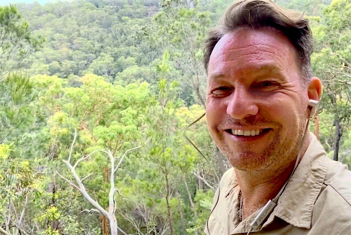 Hop A Tour guide smiling on a live streamed tour in the Australian bush near Sydney